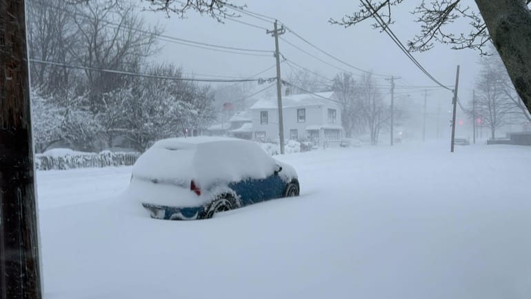 A snow-covered street in Sayville Monday morning around 7 a.m.