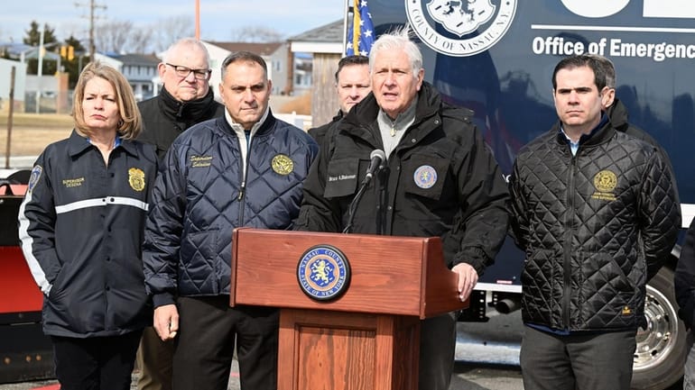 Nassau County Executive Bruce Blakeman, at the podium, is joined...