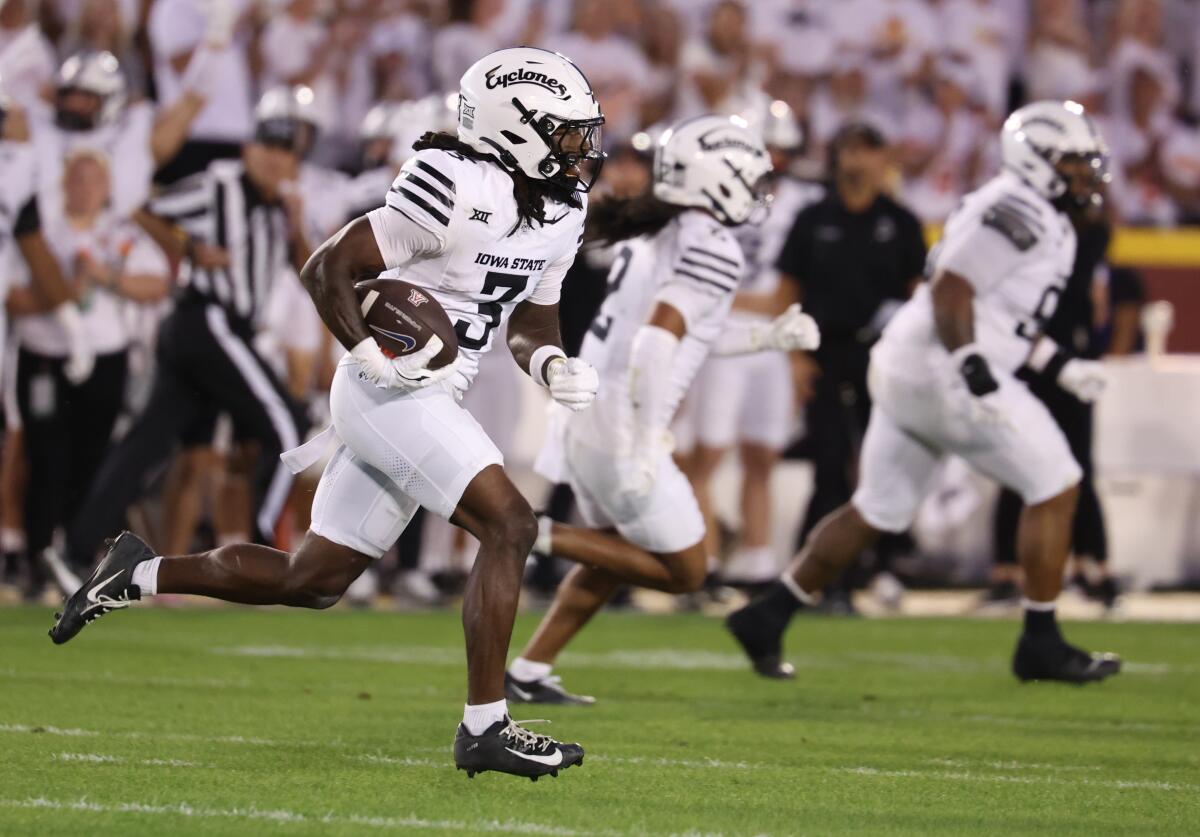 Jontez Williams returns an interception for Iowa State last season.