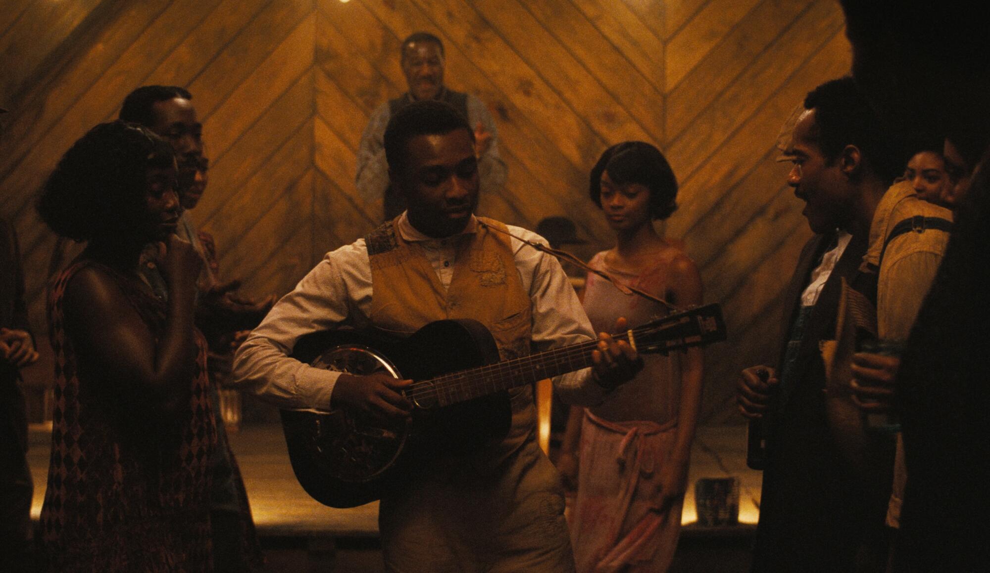 Miles Caton, center, in "Sinners."