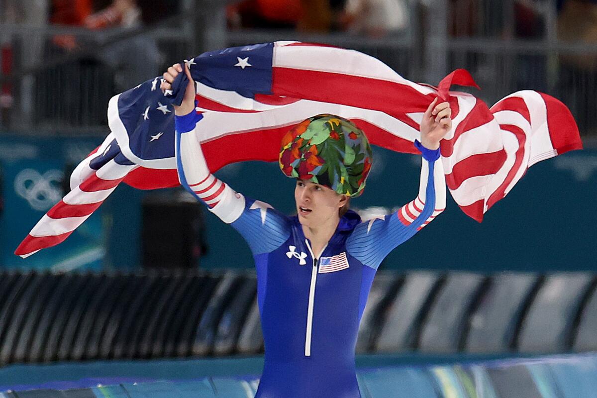 An athlete carries the U.S. flag at the Olympics