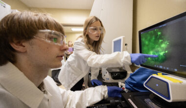 Undergraduate student Iliya Voytsyshyn, left, has developed an app to help quantify the growth patterns of neuronal cells in brain organoid models.