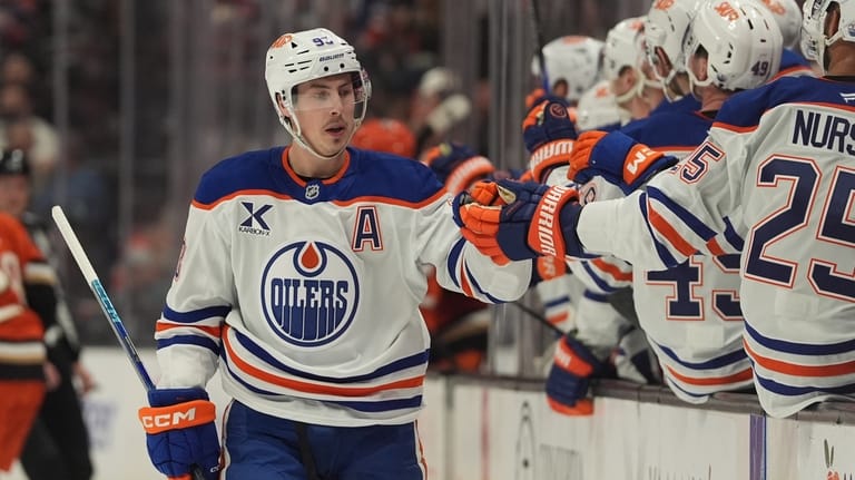 Edmonton Oilers center Ryan Nugent-Hopkins, left, celebrates his goal with...