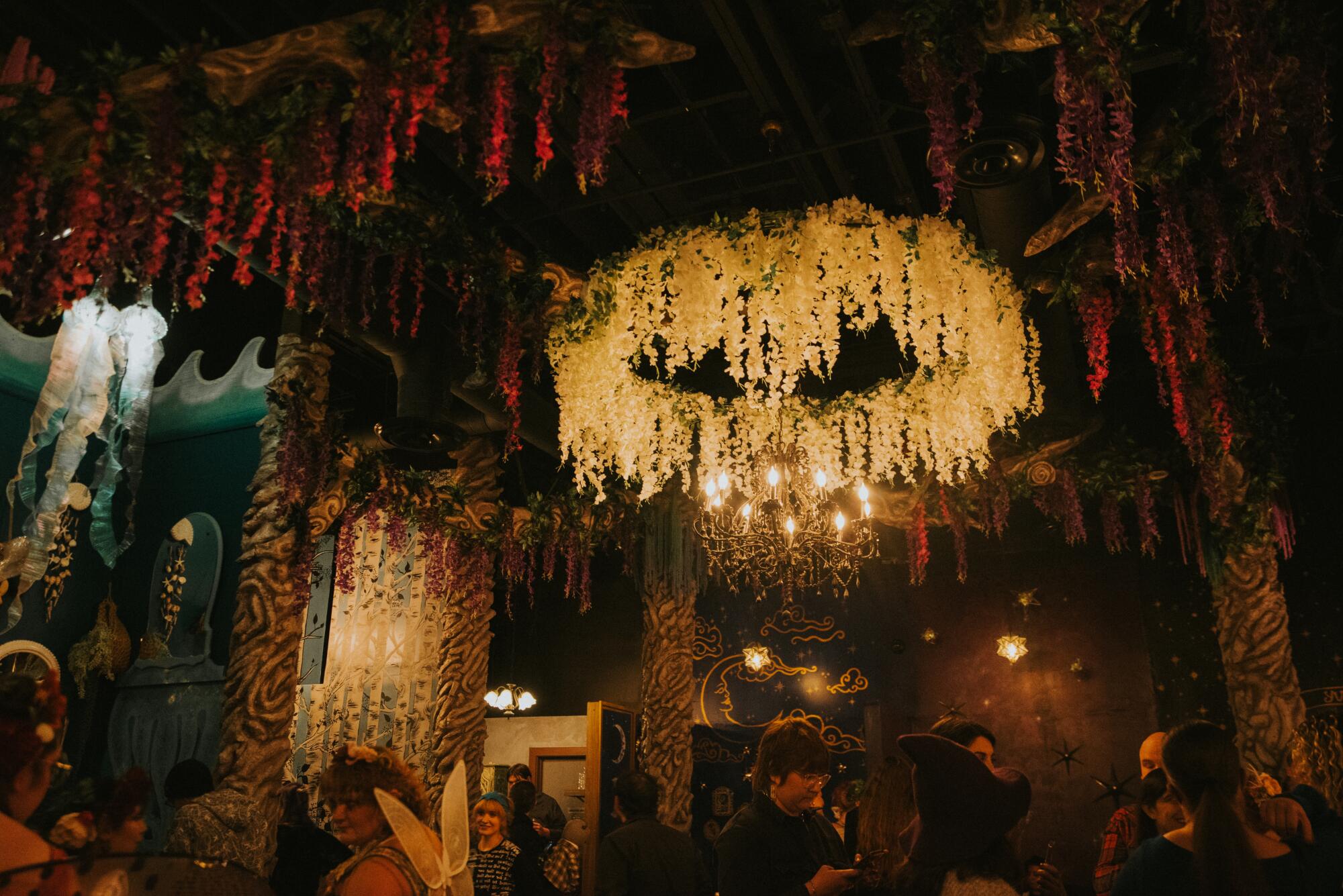 The dining room of the Witch's Cottage aims for a fantasy forest-inspired look.