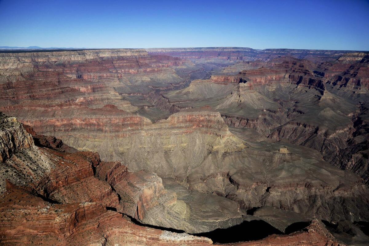 Grand Canyon National Park is covered in the morning sunlight as seen from a helicopter near Tusayan, Ariz. 