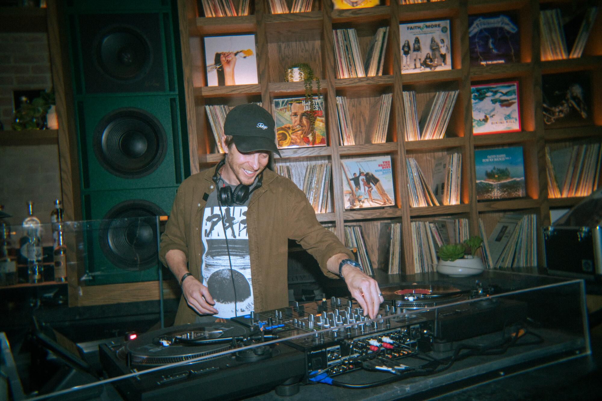 Tip Dunn, also known as DJ tenSpeed, plays music at Vinyl Room.