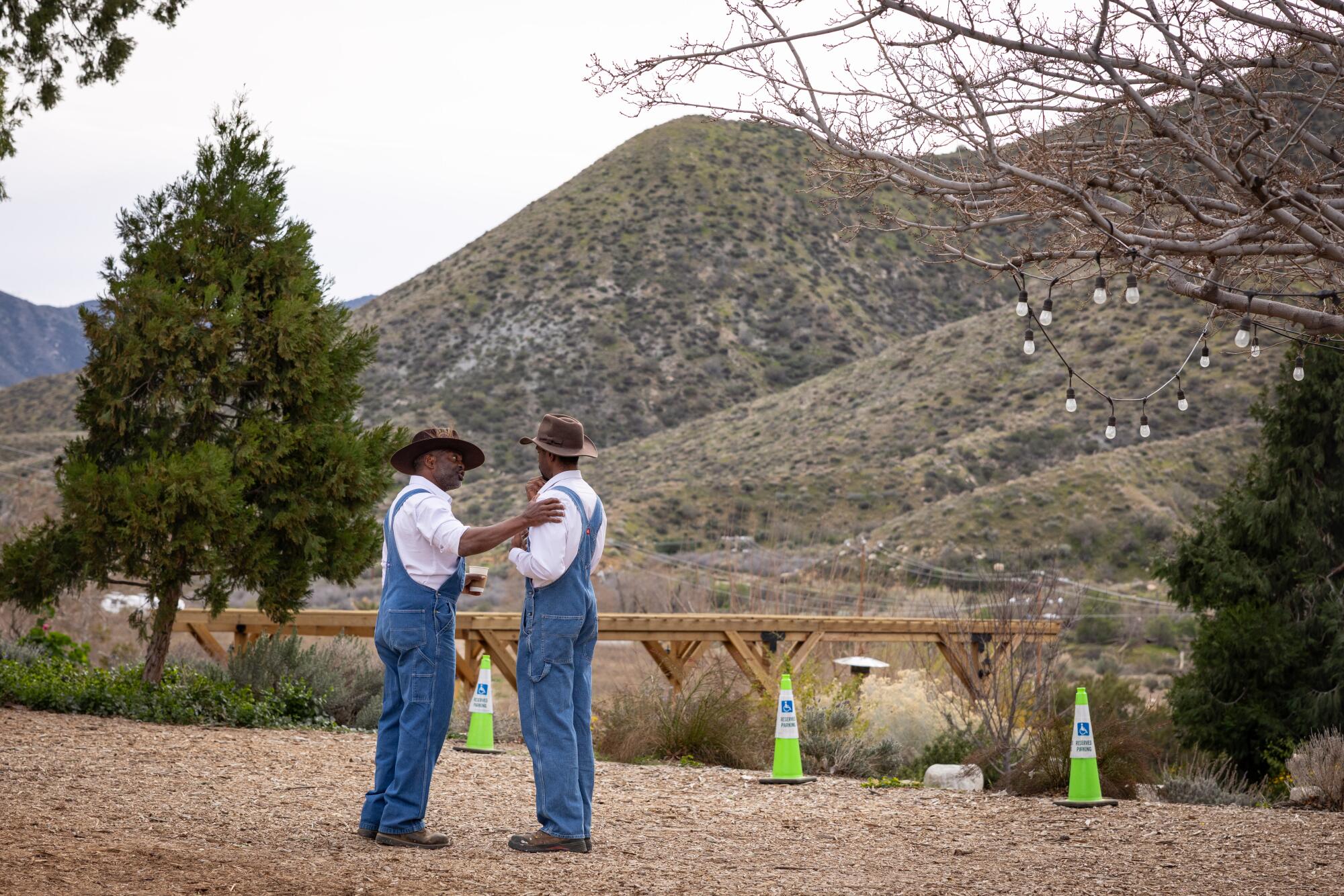 Bill Releford talks with one of his workers at the end of Sunday jazz brunch at Bloom Ranch.