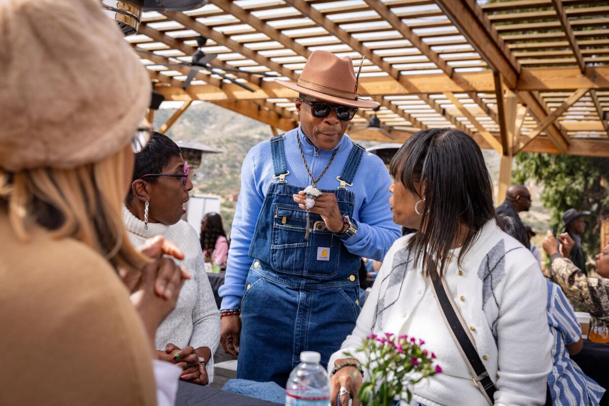 Victor Burke, a partner at the ranch, mingles with guests attending Sunday jazz brunch at Bloom Ranch.