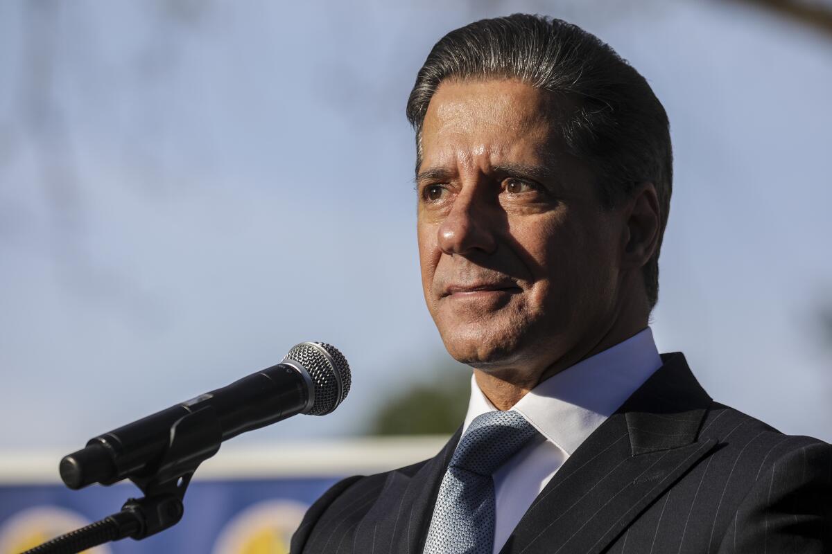 A man speaks into a microphone