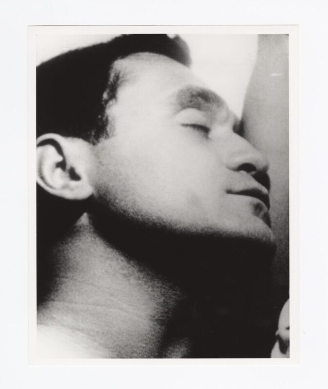 Black and white close-up photo of a man sleeping. 