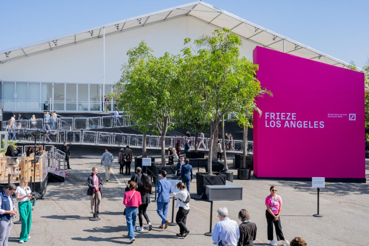 People walk around Frieze Los Angeles 2025