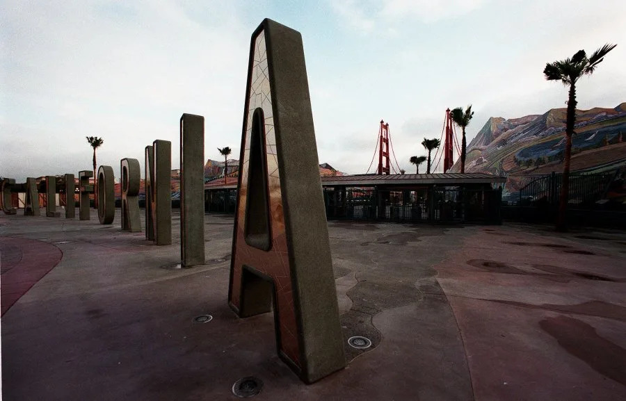 TO GO WITH STORY TITLED TRAVEL NEW DISNEY PARK–Large concrete letters mark the entrance to the new California Adventure, the latest addition to the Walt Disney theme park family, in Anaheim, Calif., Dec. 8, 2000. The park, adjacent to Disneyland, opens Feb. 8 and will feature miniature versions of the best the state has to offer, from historic landmarks to its natural terrain, wrapped around rides, stores and restaurants. (AP Photo/Damian Dovarganes)