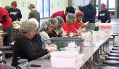 Local students assemble meals to be sent to Southeast Asia