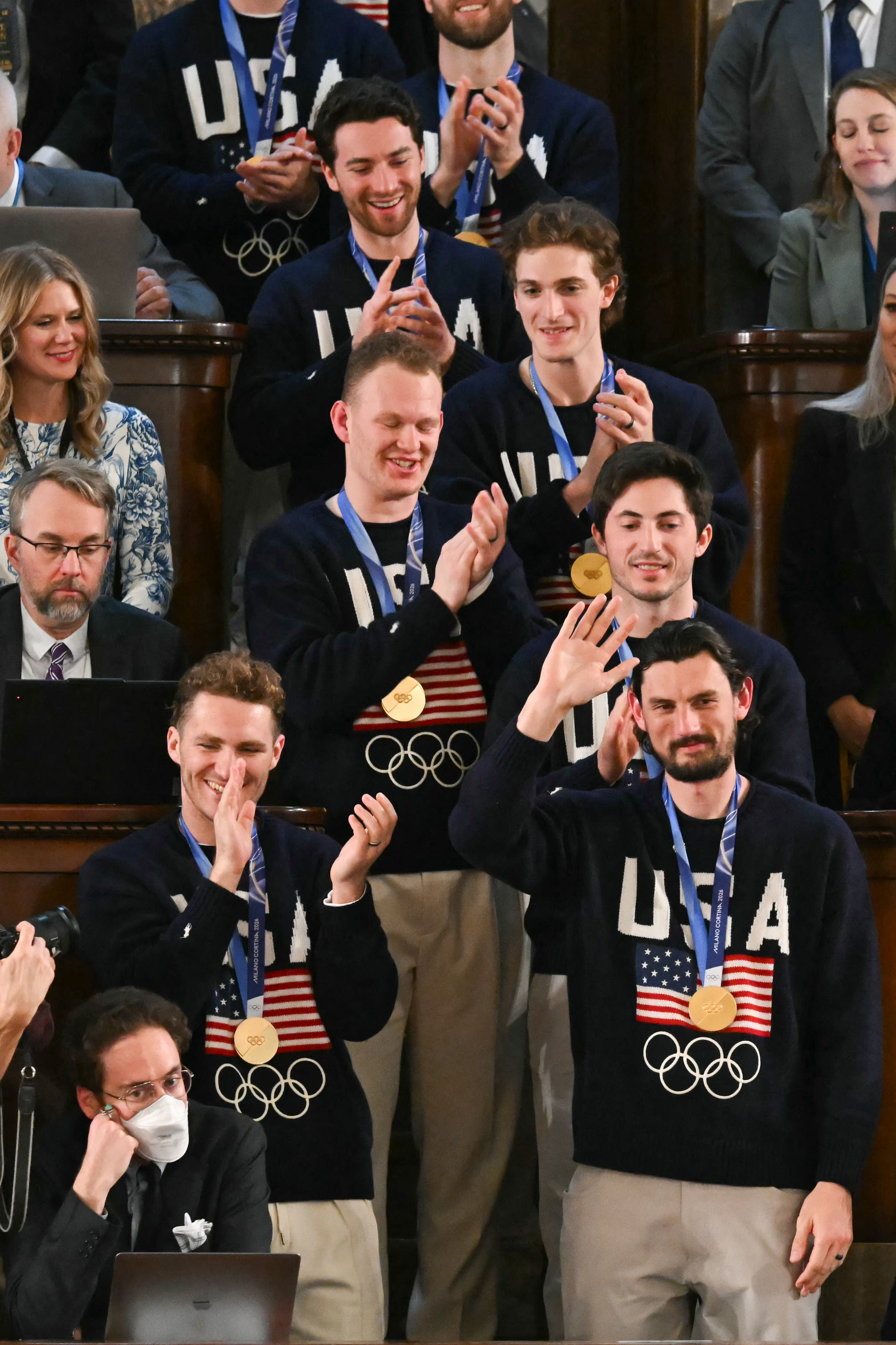 Goalie Connor Hellebuyck (R) gestures as members of the U.S. Men's Olympic hockey team are recognized by President Donald Trump in Washington, DC, on February 24, 2026.