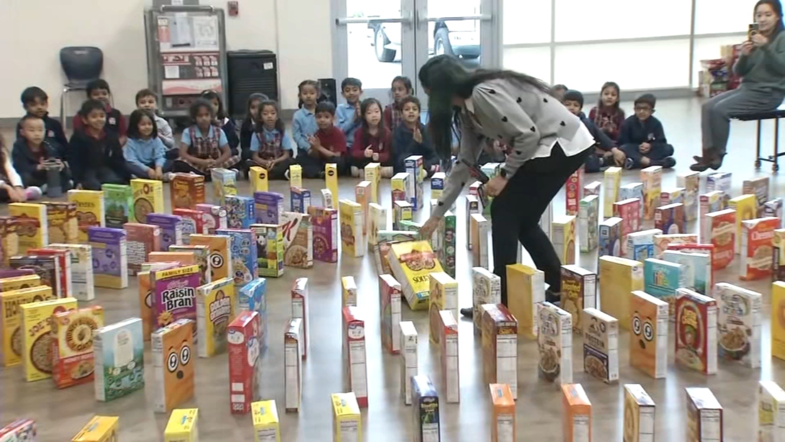 Stratford School's Beresford Square campus in Milpitas holds domino run with hundreds of cereal boxes during donation drive