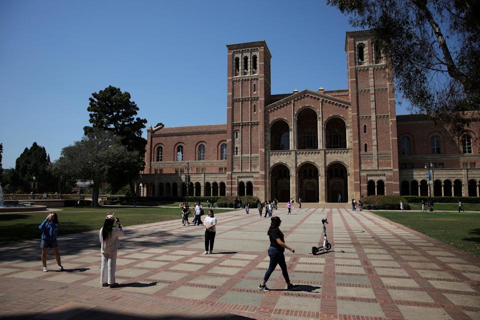 People walk through the campus of the University of California Los Angeles (UCLA) in Los Angeles, California, U.S., August 11, 2025. REUTERS/Daniel Cole