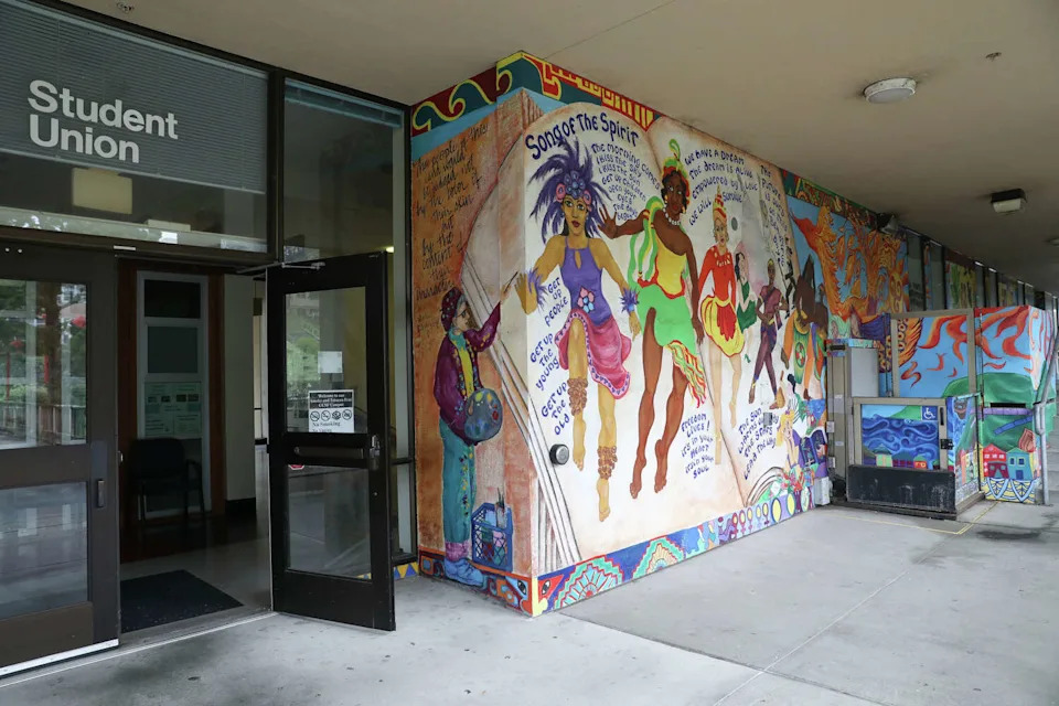 The mural "Song of the Spirit" by Precita Eyes Muralists with City College students is seen outside the Student Union at City College of San Francisco. (Lea Suzuki/S.F. Chronicle)