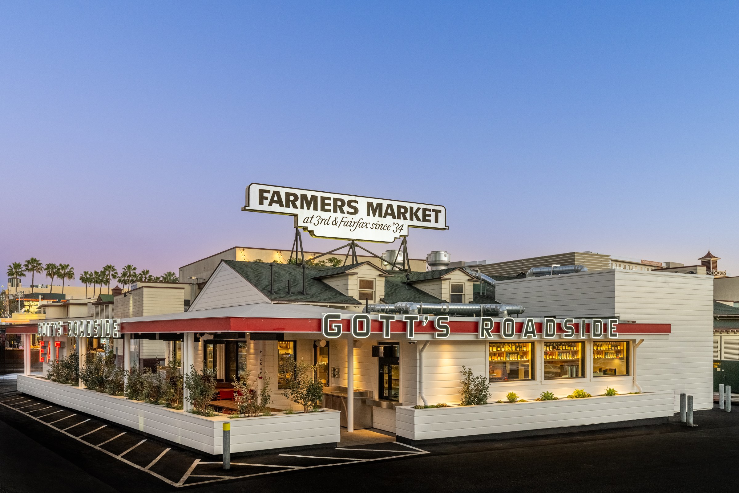 Exterior of Gott’s Roadside at the Original Farmers Market at dusk.