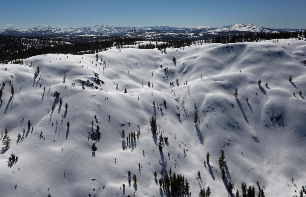 FILE PHOTO: The snow-covered Sierra Nevada Mountains are seen from the air during a Pacific Gas and Electric snowpack surv...