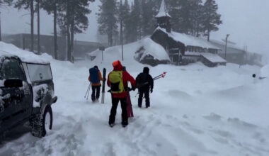 A rescue team departs to the site of an avalanche where skiers were stranded, in Nevada County