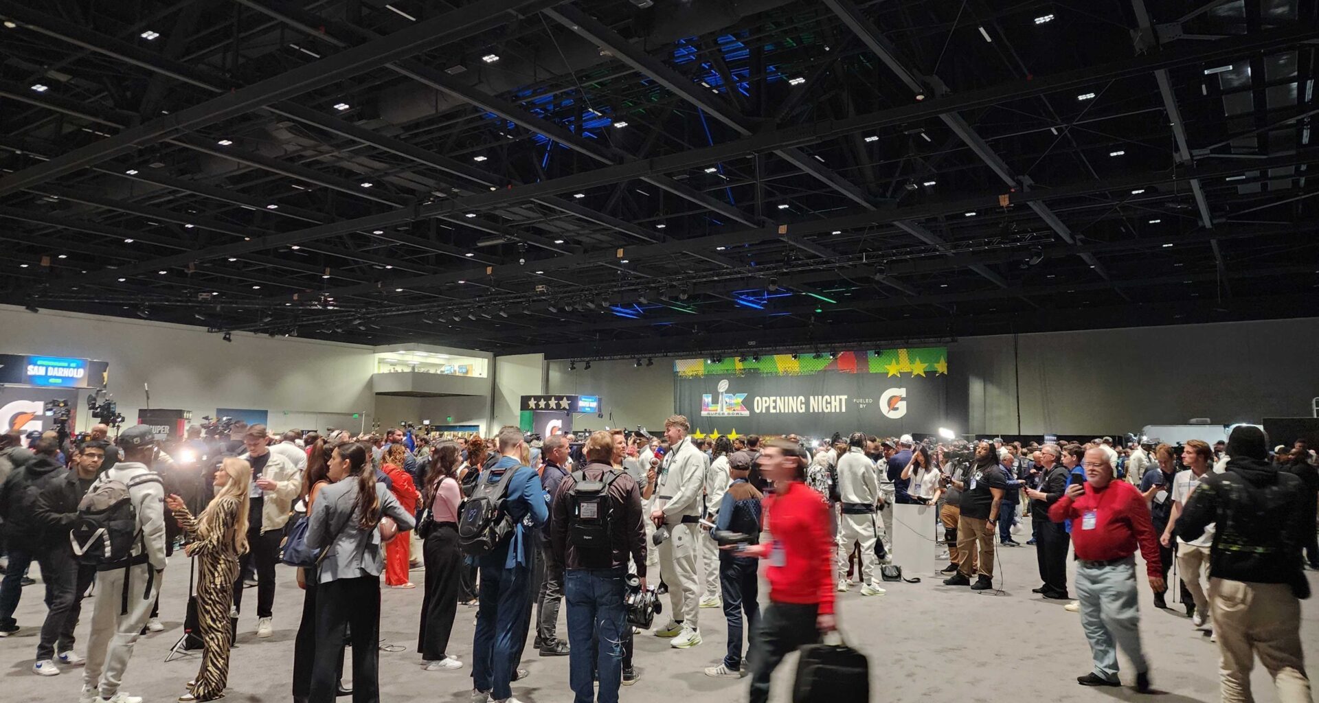 People walking in convention center.