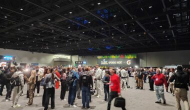 People walking in convention center.