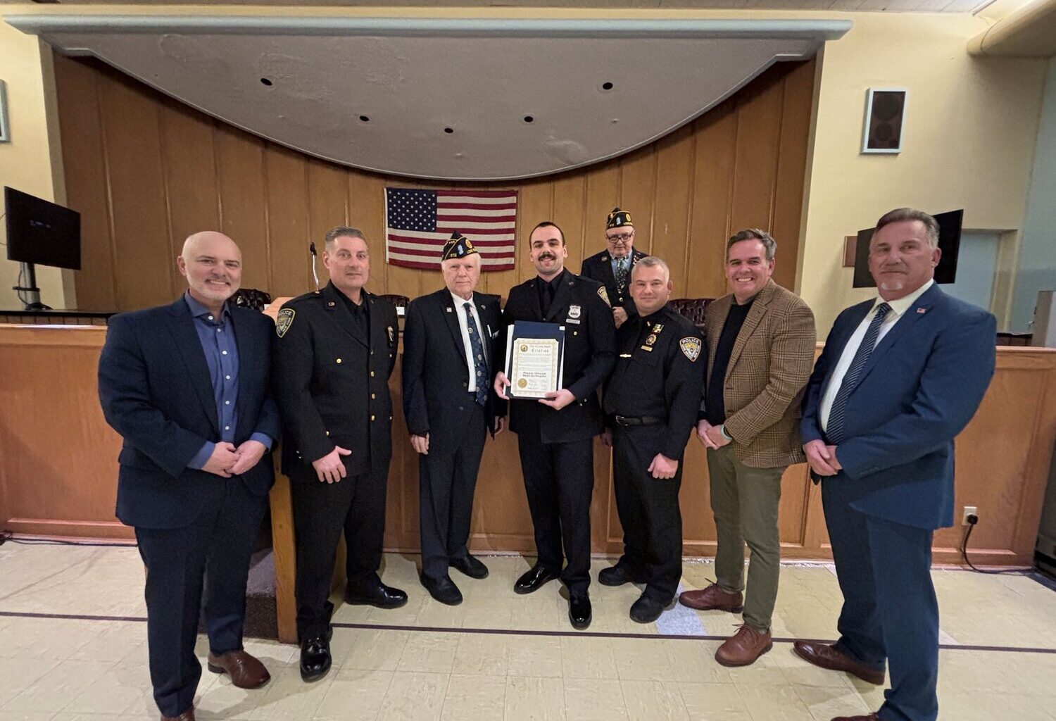 Long Beach Police Department&rsquo;s Sean Gutfleisch, center, was honored at Law and Order Night on Feb. 7 for a water rescue he performed in July.
