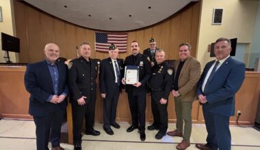 Long Beach Police Department&rsquo;s Sean Gutfleisch, center, was honored at Law and Order Night on Feb. 7 for a water rescue he performed in July.