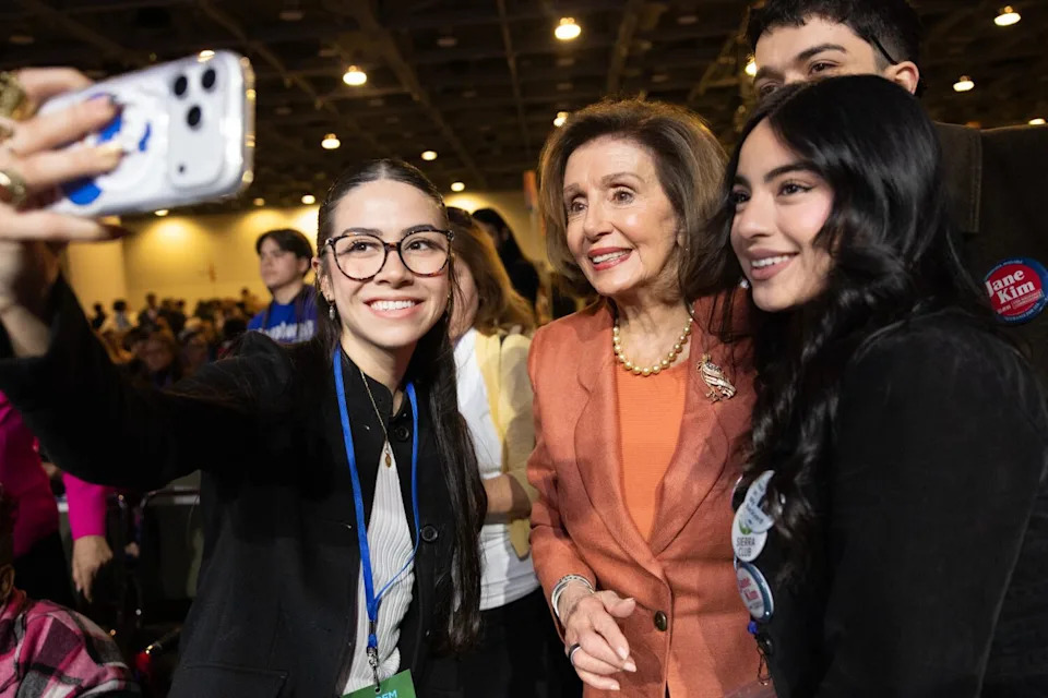Speaker Emerita Nancy Pelosi (D-CA) takes a selfie with supporters.