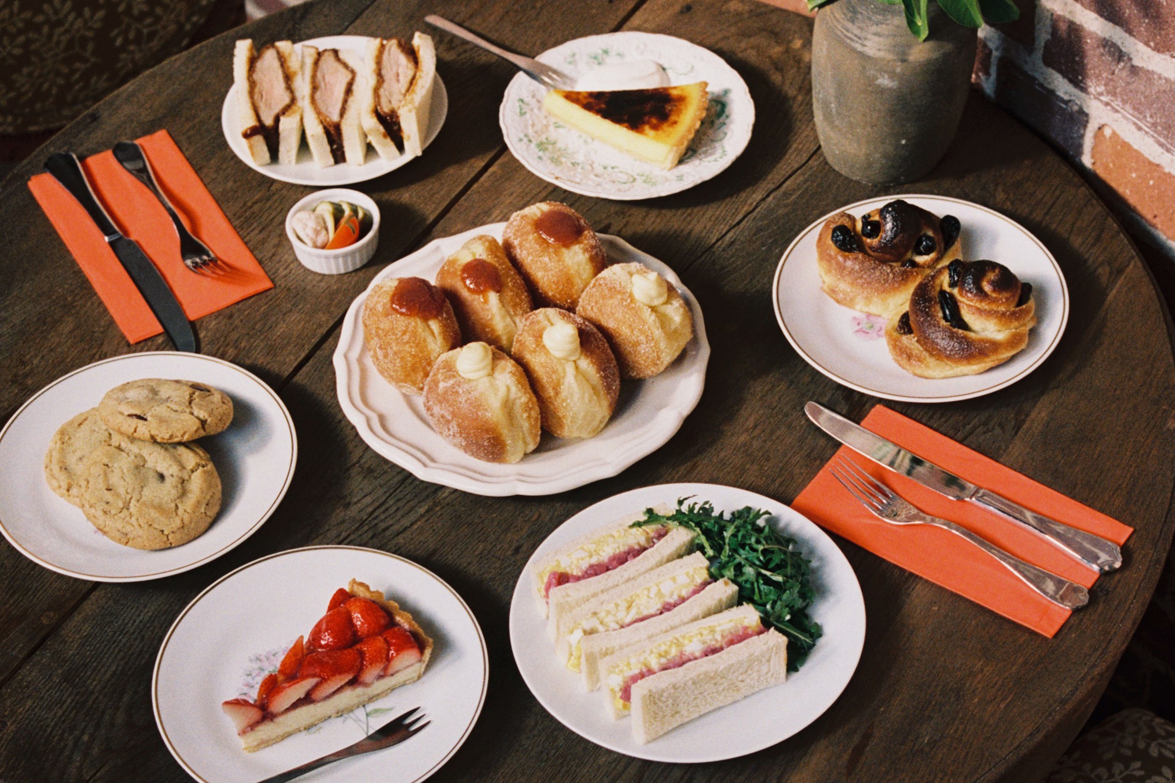 Daytime dishes with sandwiches and pastries.