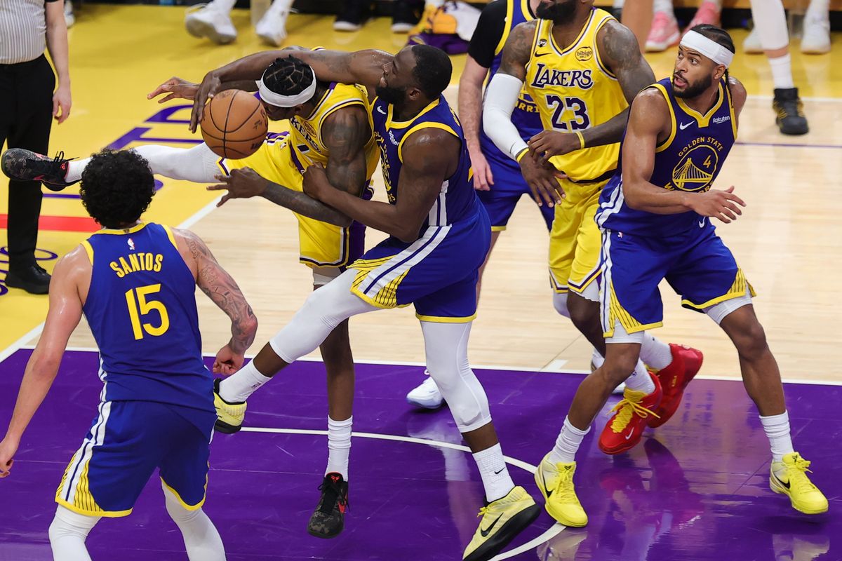 Los Angeles Lakers forward Jarred Vanderbilt (2) takes a hard foul from Golden State Warriors forward Draymond Green (23) during an NBA game on February 7, 2025 in Los Angeles, CA.
