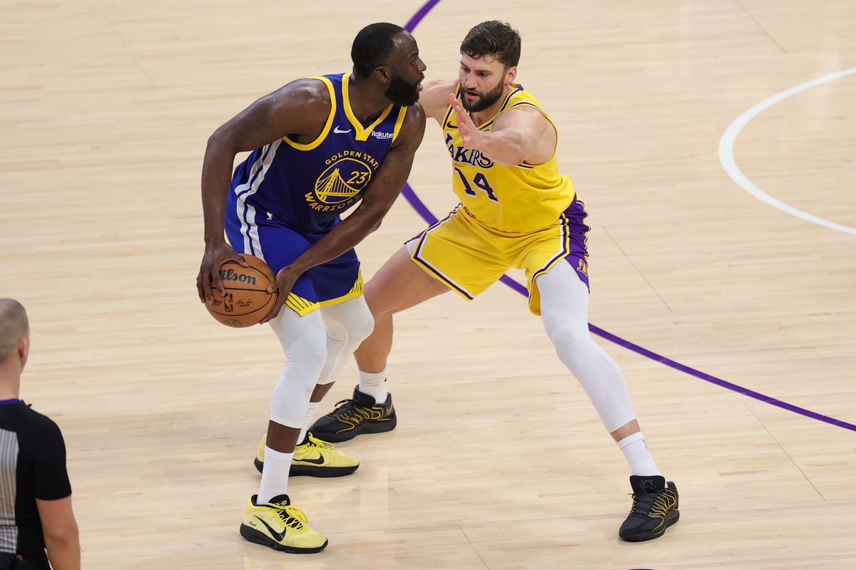 Los Angeles Lakers forward Maxi Kleber (14) defends against Golden State Warriors forward Draymond Green (23) during an NBA game on February 7, 2025 in Los Angeles, CA.