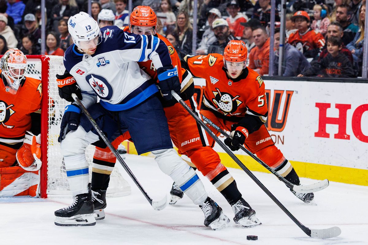Winnipeg Jets center Gabriel Vilardi (13) attempts to secure the puck during an NHL match against the Anaheim Ducks on February 27, 2026 in Anaheim, California.