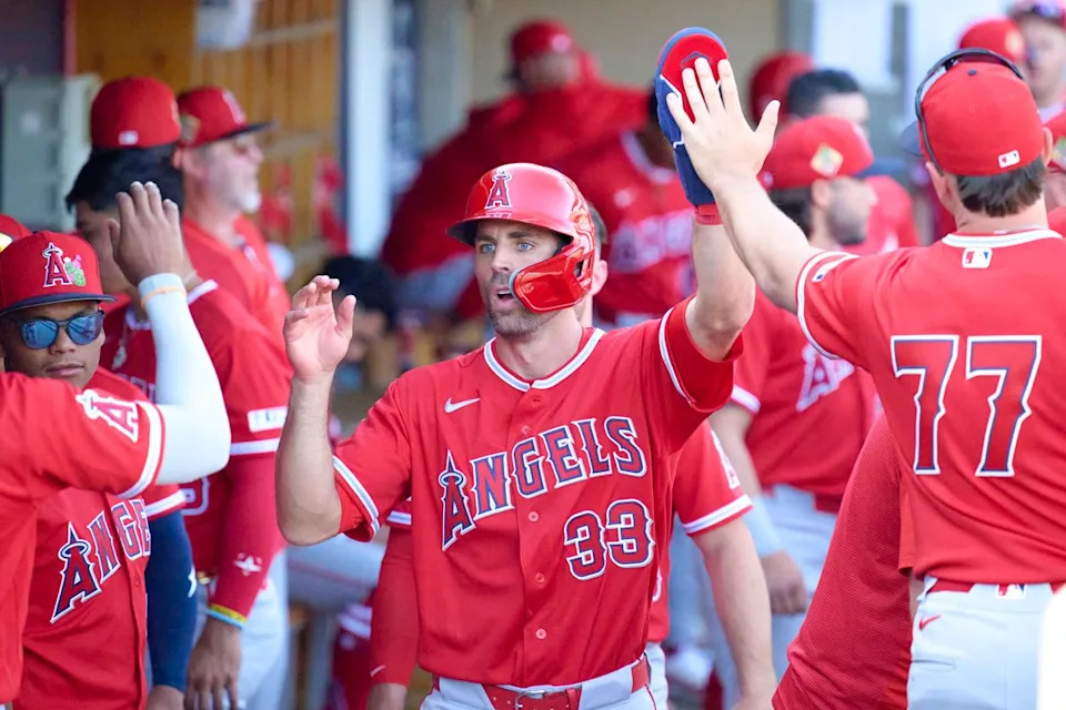 The Los Angeles Angels left fielder Chris Taylor (33) celebrates a run scored against The Arizona Diamondbacks ,February 22nd, 2026 in Scottsdale Arizona.