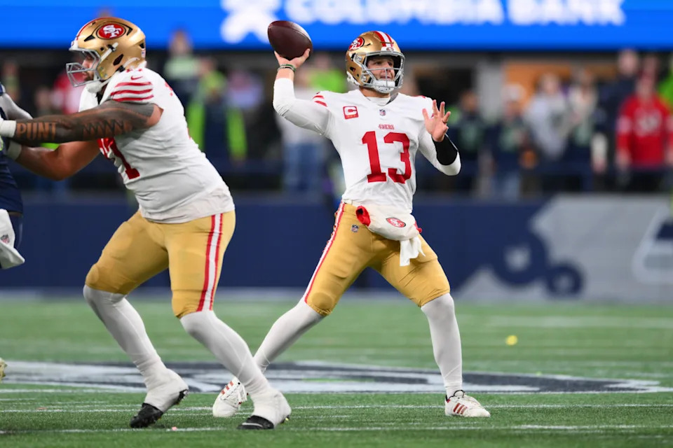 Jan 17, 2026; Seattle, WA, USA; San Francisco 49ers quarterback Brock Purdy (13) throws downfield against the Seattle Seahawks during the first half in an NFC Divisional Round game at Lumen Field. Mandatory Credit: Steven Bisig-Imagn Images© Steven Bisig-Imagn Images.