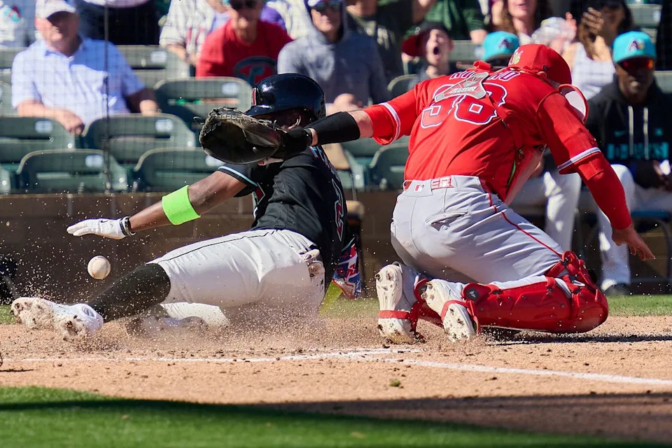 The Los Angeles Angels catcher Sebastián Rivero (38) attempts an out at home against The Arizona Diamondbacks ,February 22nd, 2026 in Scottsdale Arizona.