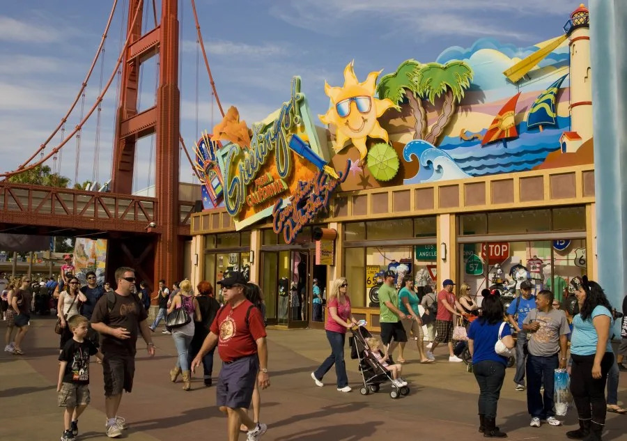 ANAHEIM, ORANGE COUNTY, CA – 2010: Visitors walk through the entrance to Disney’s California Adventure as seen in this 2010 Anaheim, California, spring afternoon photo. (Photo by George Rose/Getty Images)