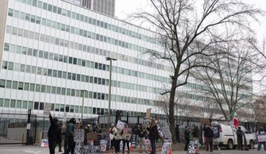 Anti-ICE protesters wave signs outside the John Moss Federal Building in Sacramento on Sunday, Jan. 25, 2026. Protesters have been protesting outside the building on and off for months since Immigration and Customs Enforcement started detaining immigrants in the building.