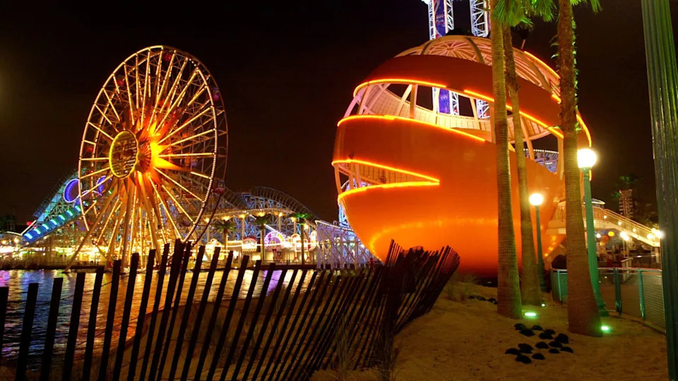 The Orange Stinger ride next to the Sun Wheel rideGetty