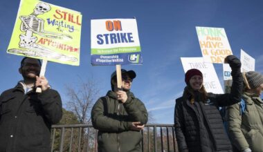 Striking health care workers wave signs outside Kaiser Permanente’s Roseville Medical Center on Jan. 26 in Roseville as part of a monthlong labor walkout. The union later Monday that workers would return Tuesday after reporting “significant movement” in contract talks with Kaiser.