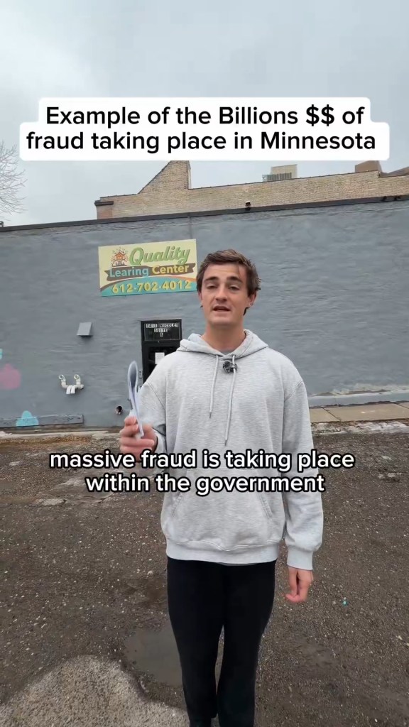 Man standing in front of a closed building with a sign for "Quality Learing Center," highlighting alleged fraud.