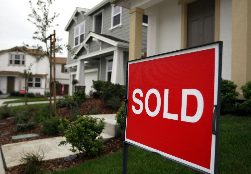 SOUTH SAN FRANCISCO, CA - MAY 04: A sold sign is posted in front of a home at a new housing development May 4, 2009 in South San Francisco, California. A report by the National Association of Realtors says that pending home sales were up 3.2 percent to 84.6 in March as home buyers took advantage of historically low mortgage interest rates and low home prices. (Photo by Justin Sullivan/Getty Images)
