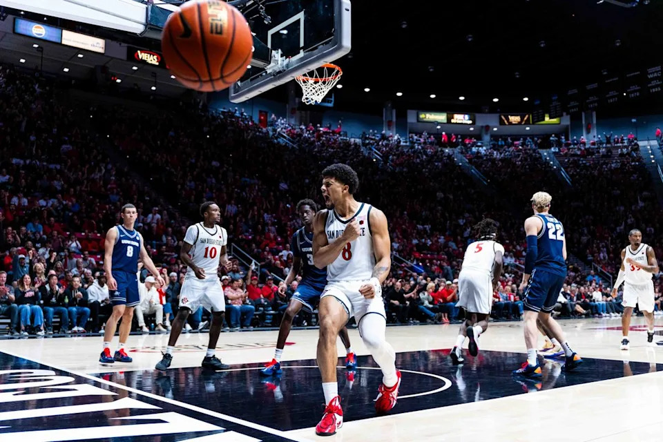 San Diego State forward Tae Simmons (8) reacts to a dunk during an NCAA Basketball game between Utah State and San Diego State, Wednesday February 25, 2026 at Viejas Arena in San Diego, Calif.