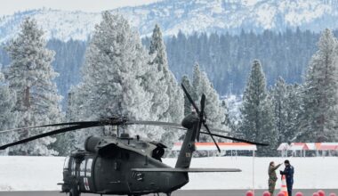 A member of the US Army and a member of the California Highway Patrol spoke on the runway at the Truckee Tahoe Airport amid recovery efforts for a group of missing skiers in Truckee, Calif., on Saturday.