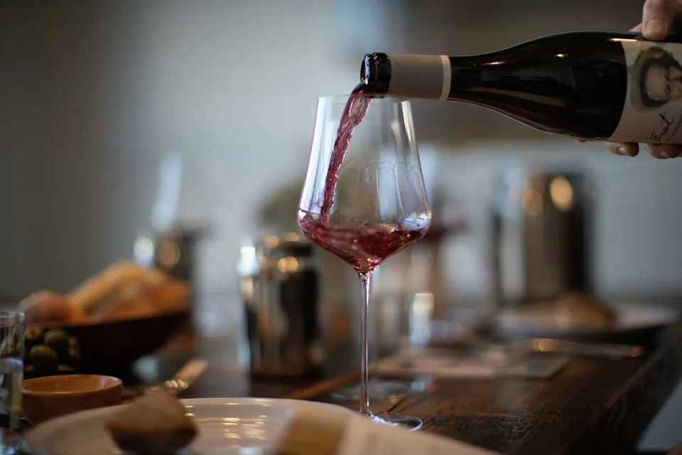 Erin Brooks pours wine during a tasting for customers in 2019. (Paul Kuroda/For the S.F. Chronicle)