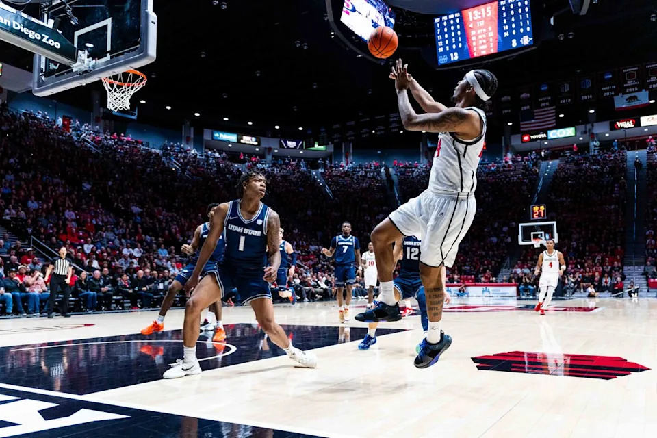San Diego State guard Taj DeGourville (24) takes a shot during an NCAA Basketball game between Utah State and San Diego State, Wednesday February 25, 2026 at Viejas Arena in San Diego, Calif.