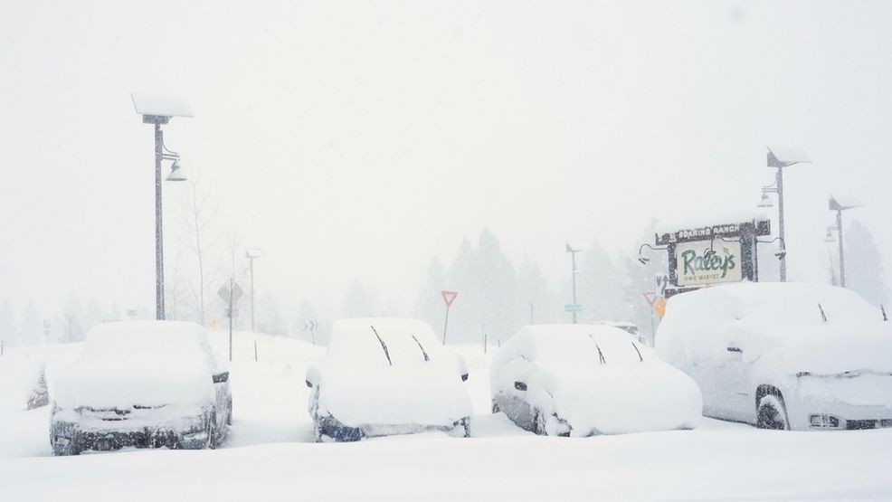 Cars are covered in snow during a snow storm on Tuesday, Feb. 17, 2026 in Truckee Calif. (AP Photos/Brooke Hess-Homeier)