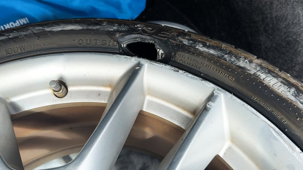 Hole punched in June Gautier's tire during pursuit of the U-Haul van.