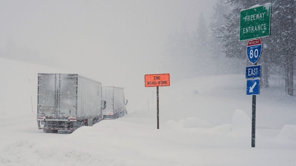 Trucks are lined up along Interstate 80 during a storm on Tuesday, Feb. 17, 2026 in Truckee Calif. (AP Photos/Brooke Hess-Homeier)