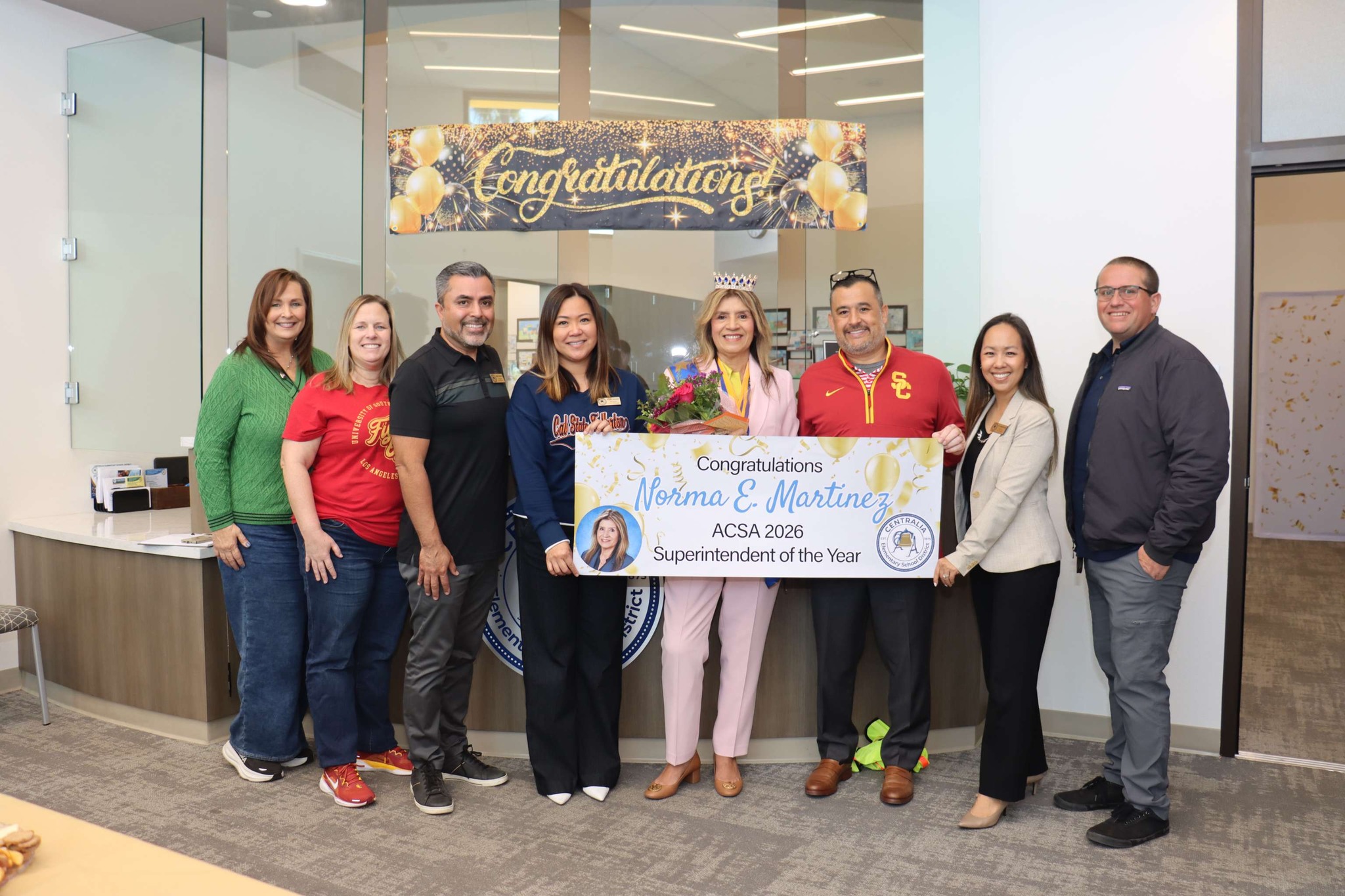 Dr. Norma E. Martinez (center) stands with Centralia School District colleagues holding a sign recognizing her as the 2026 ACSA Region 17 Superintendent of the Year.